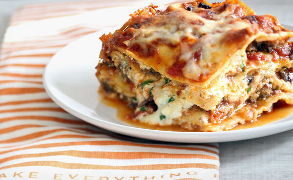 Lasagna sitting on a plate.