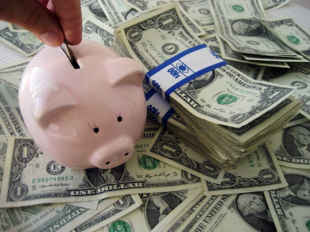 Piggybank and dollar bills