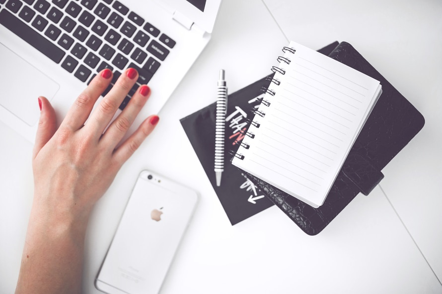 woman-hand-smartphone-desk-large